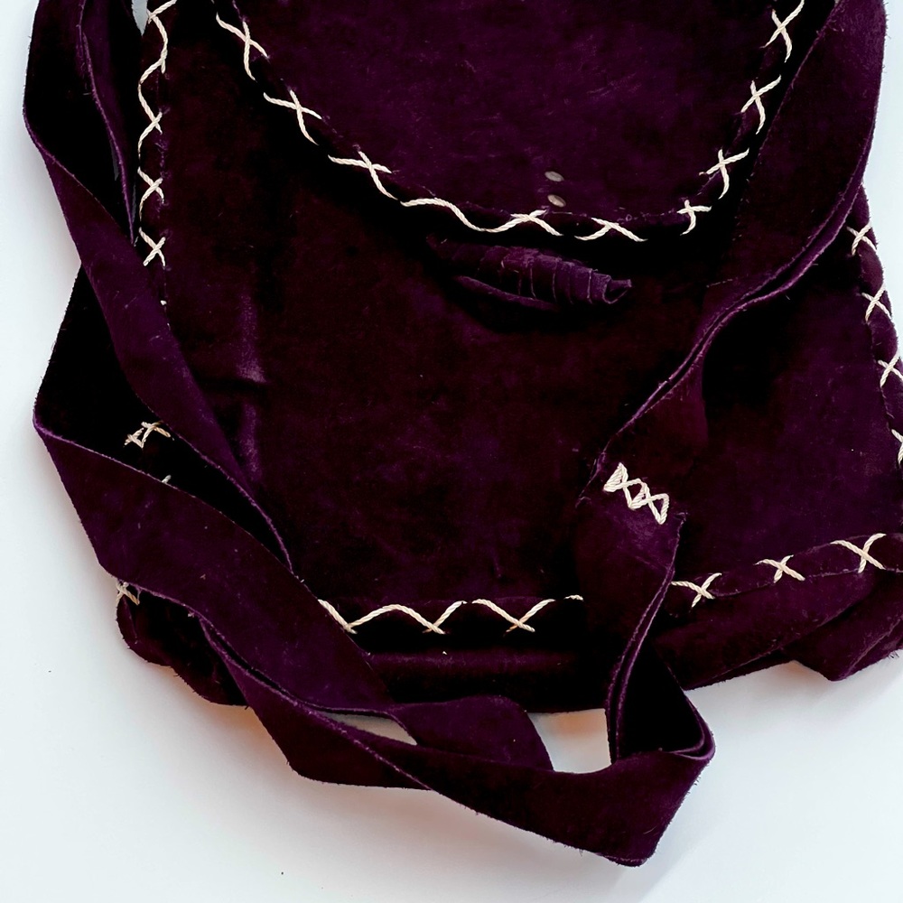 This is a beautiful suede crossbody bag. Great for Bohemian style outfits.
